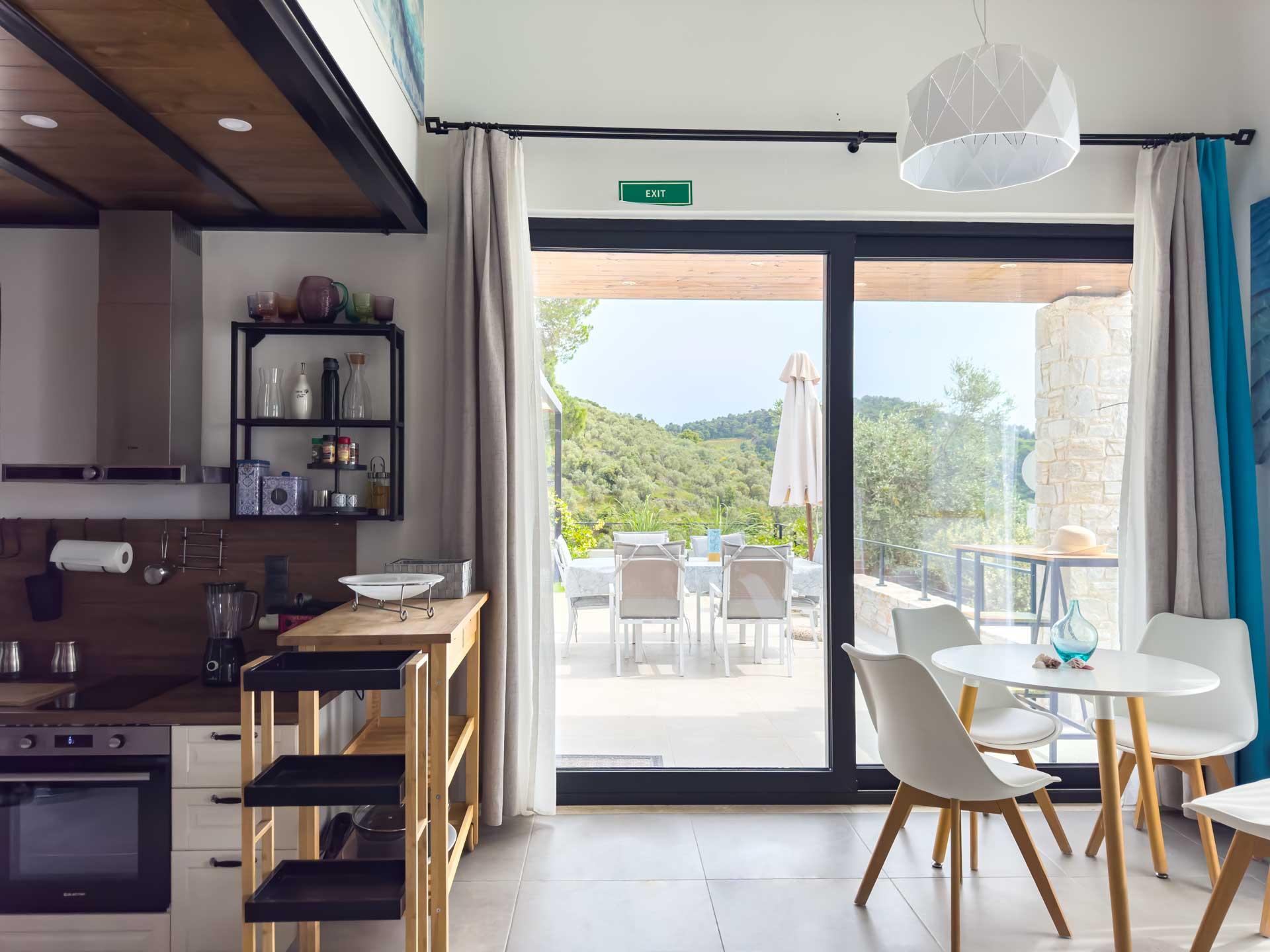 Luxury villa interior in Skiathos Greece with Aegean Sea views through open windows