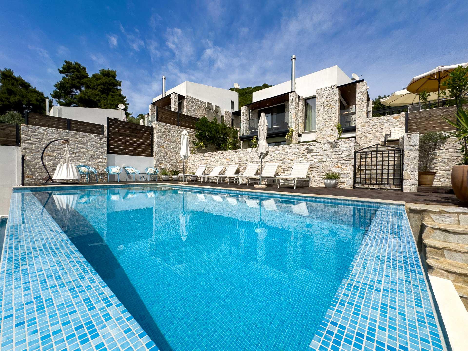 Private infinity pool at sunset with Aegean sea views in Skiathos