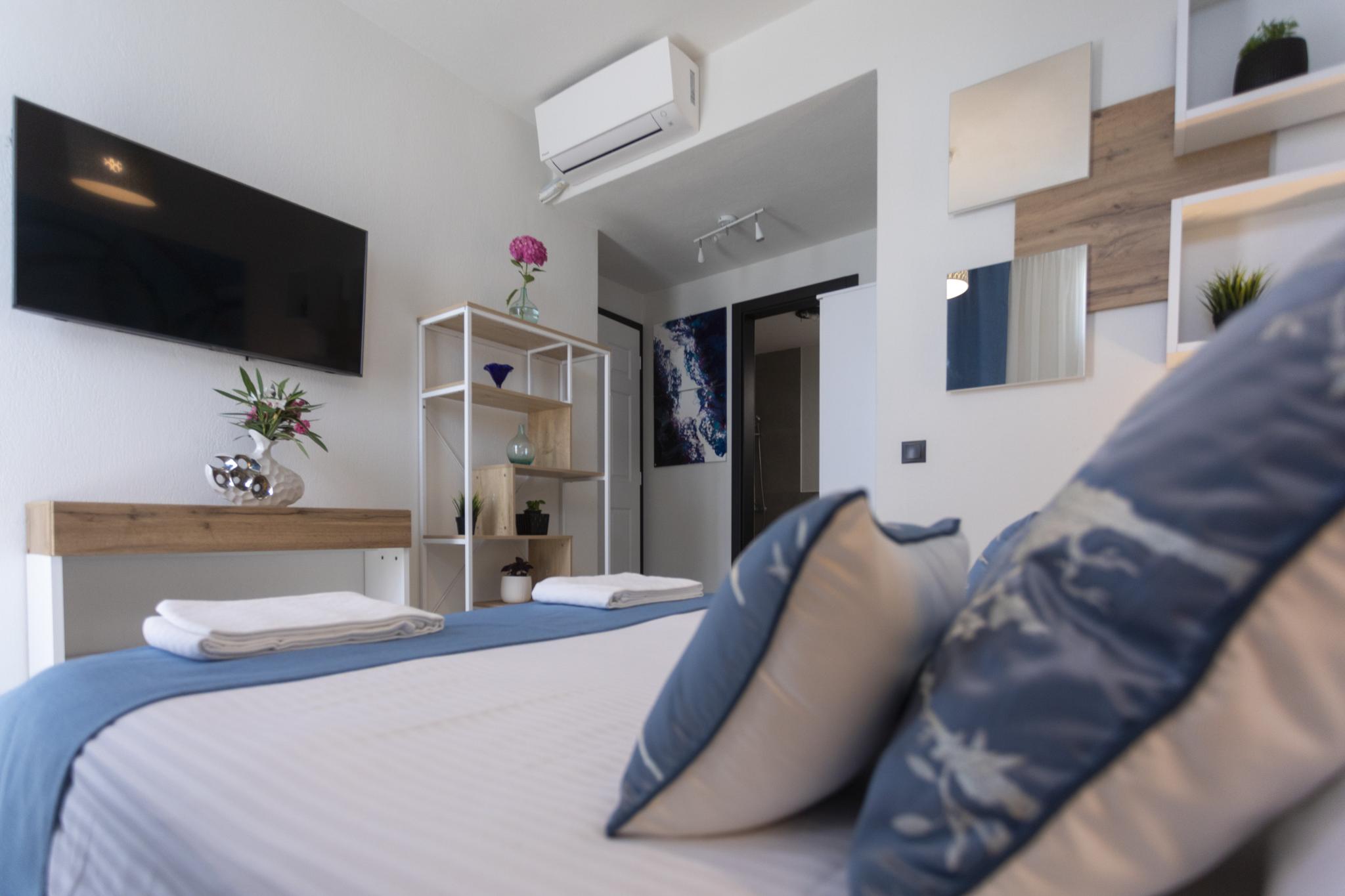 Private villa bedroom at Damari Retreat in Skiathos Kechria pine forest area, a direct gateway to the island's 14 marked hiking trails